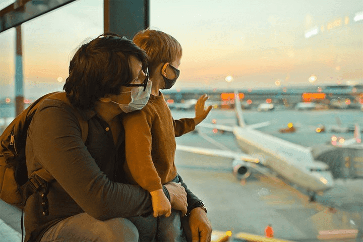 father-boy-airport-watching-aircraft-900x600