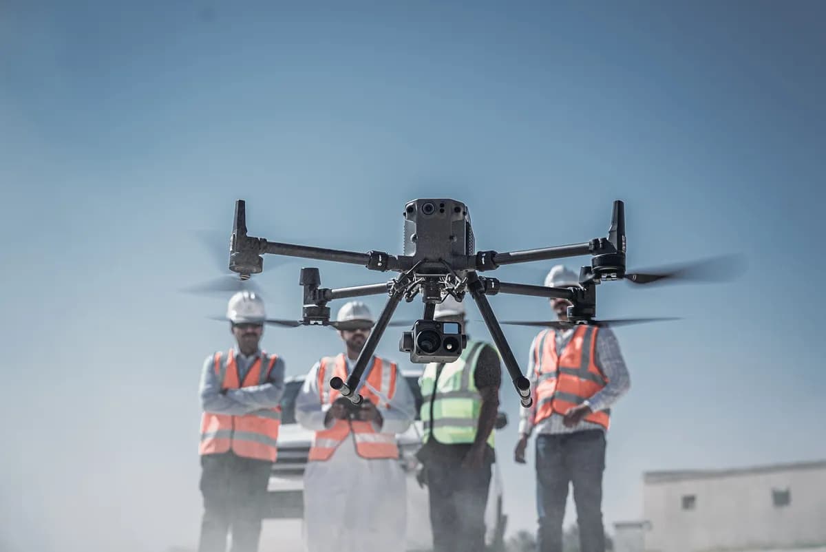 Team of surveyors launch the drone to capture data_ssict_1200_802